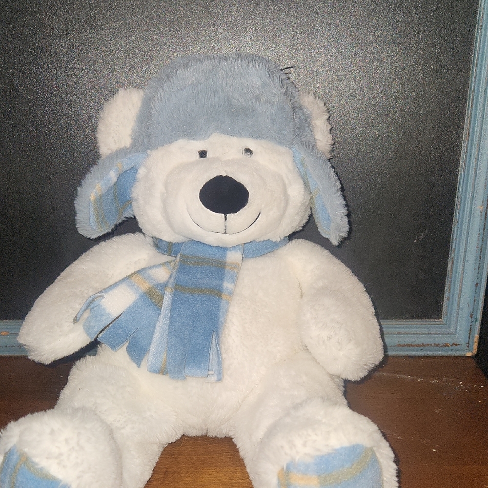 Adorable White Teddy Bear with Blue Hat and Scarf